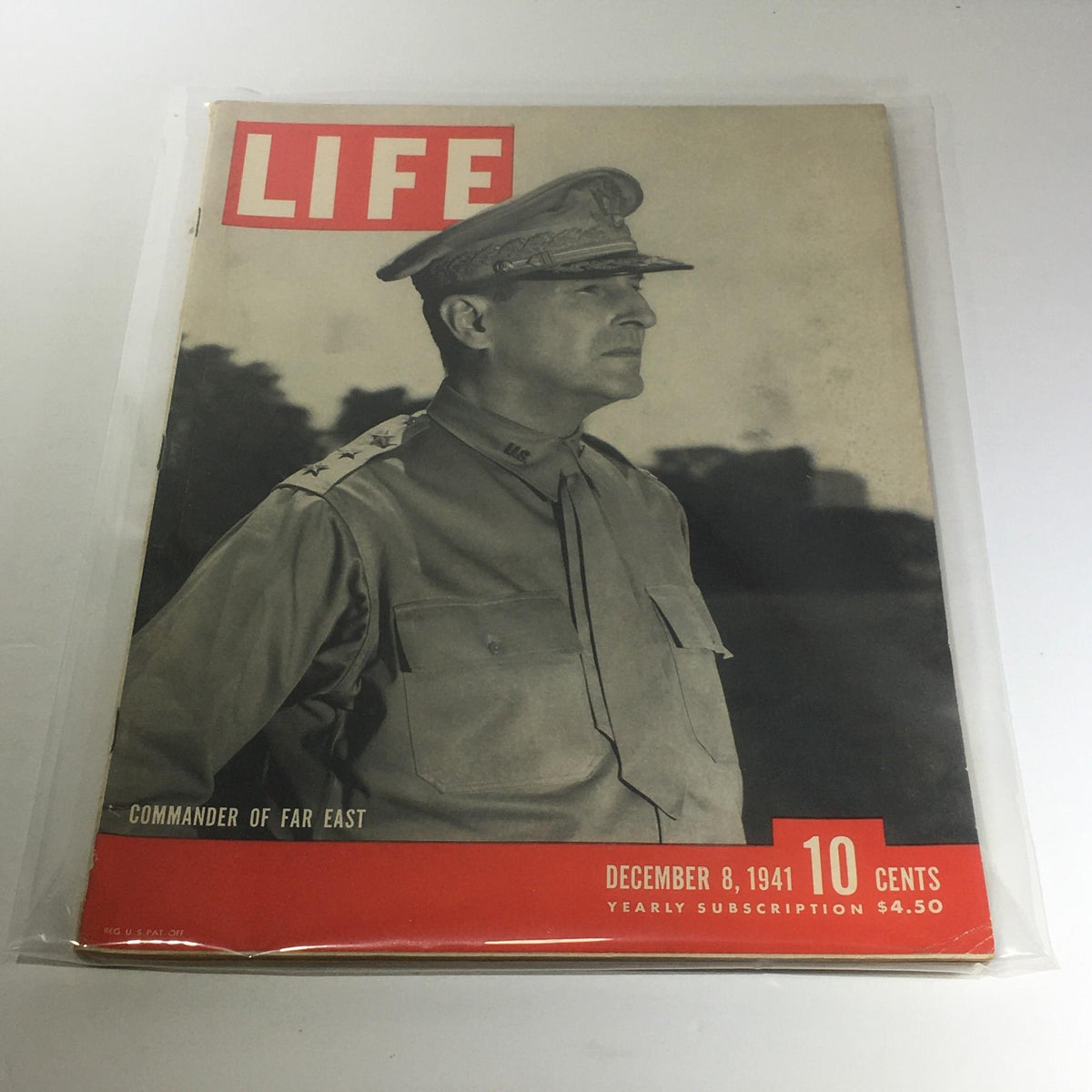Vintage Life Magazine cover from December 8, 1941, featuring Commander General Douglas MacArthur, showcasing a pivotal moment in World War II history, with a vintage aesthetic.