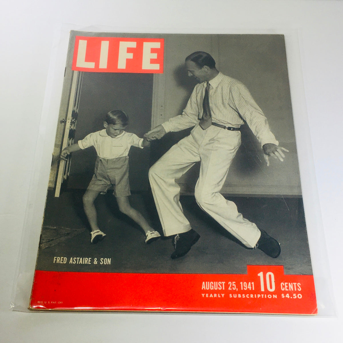 Vintage Life Magazine cover from August 25, 1941 featuring Fred Astaire dancing with a young boy, showcasing Hollywood's golden era charm.