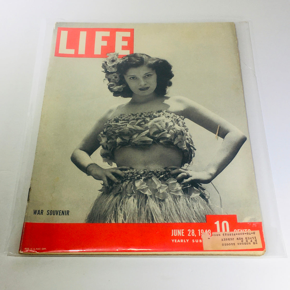 Cover of Vintage Life Magazine from June 28, 1943, featuring a model in a floral outfit, labeled as a War Souvenir, ideal for collectors and history enthusiasts.