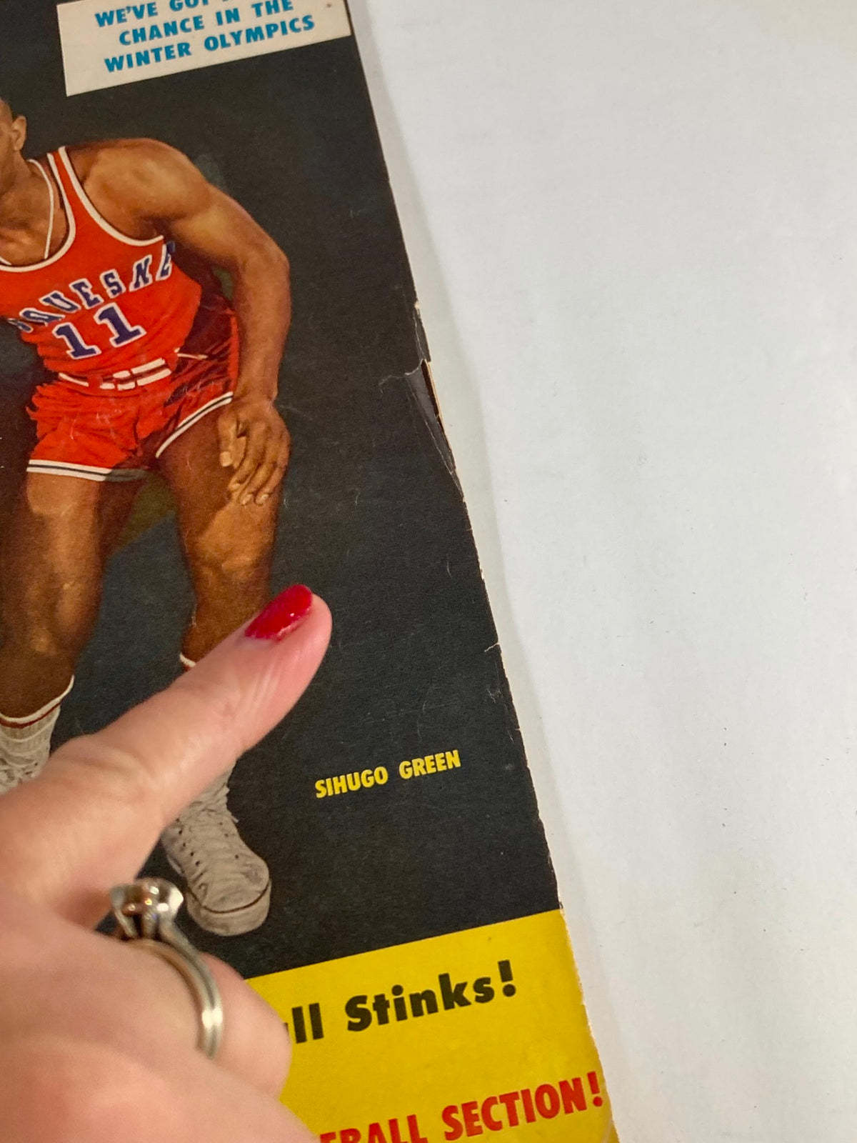 Close-up of the cover of the VTG Sport Magazine February 1956 Volume 21 showing Sihugo Green's name and part of the magazine title emphasizing its vintage appeal.