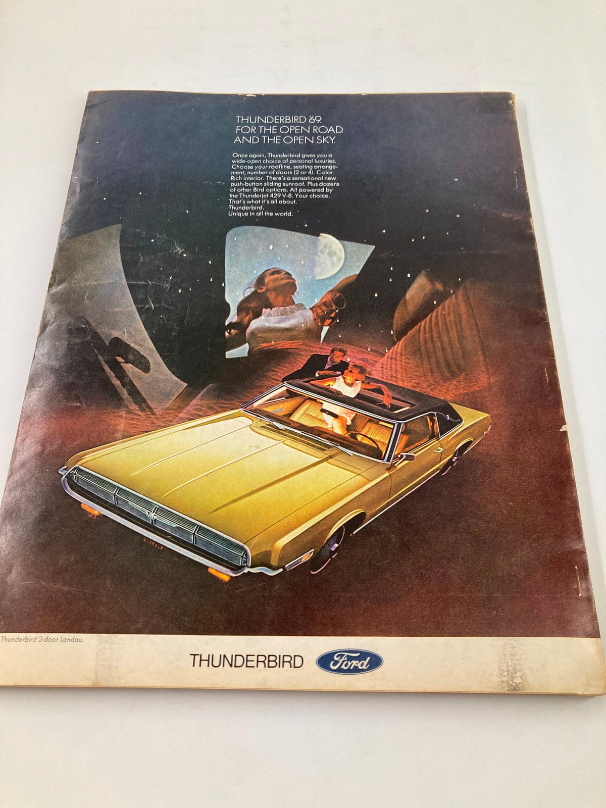 Promotional advertisement for the Ford Thunderbird 1969, featured in VTG Esquire Magazine May 1969, highlighting the car's luxurious design and open road appeal.