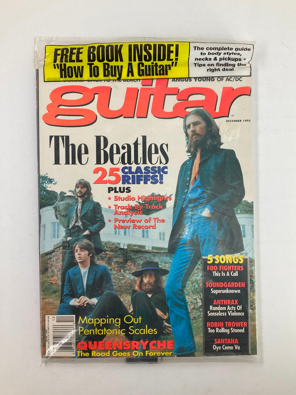 Cover of Guitar Magazine December 1995 featuring The Beatles and the headline '25 Classic Riffs'. The cover highlights a free book included and showcases various features of the issue.