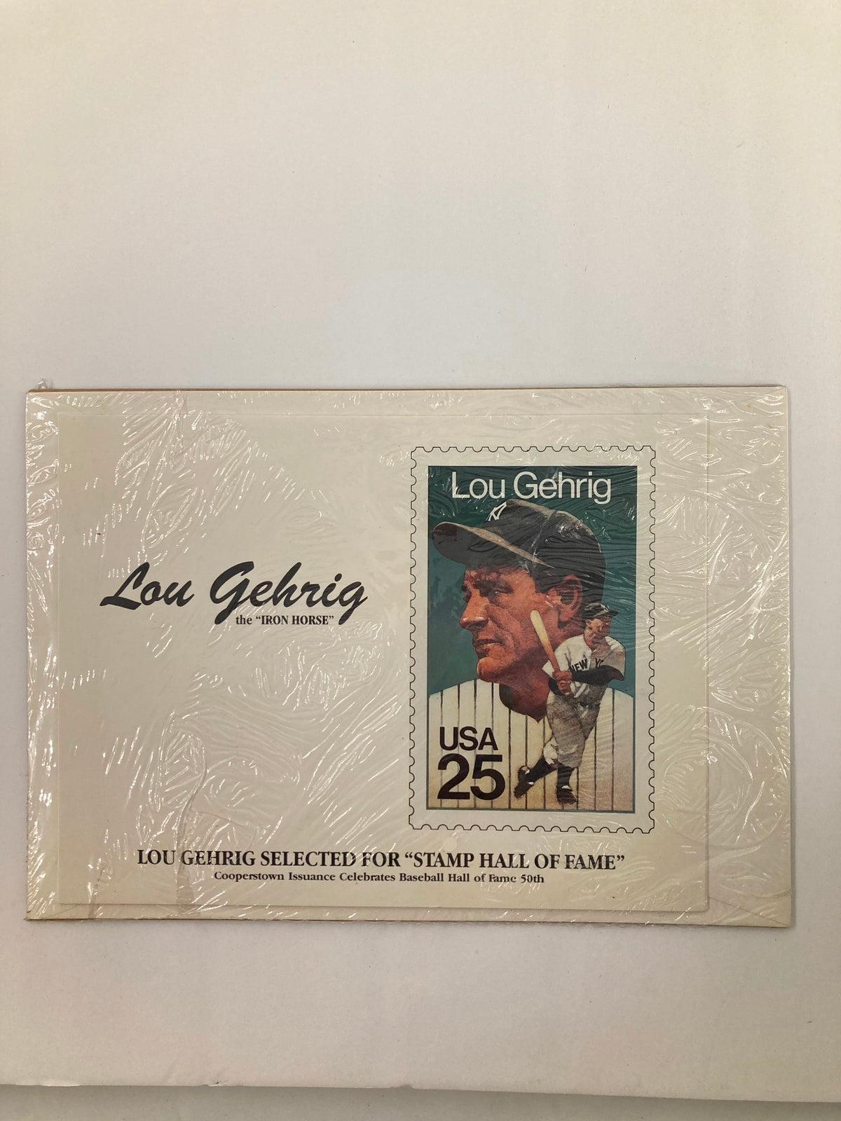 A sealed commemorative envelope featuring the 'Iron Horse' Lou Gehrig, selected for the 'Stamp Hall of Fame'. The envelope displays a unique stamp of Lou Gehrig with the inscription 'Lou Gehrig Selected for Stamp Hall of Fame' and 'USA 25'. This collectible celebrates Lou Gehrig's legacy in baseball.