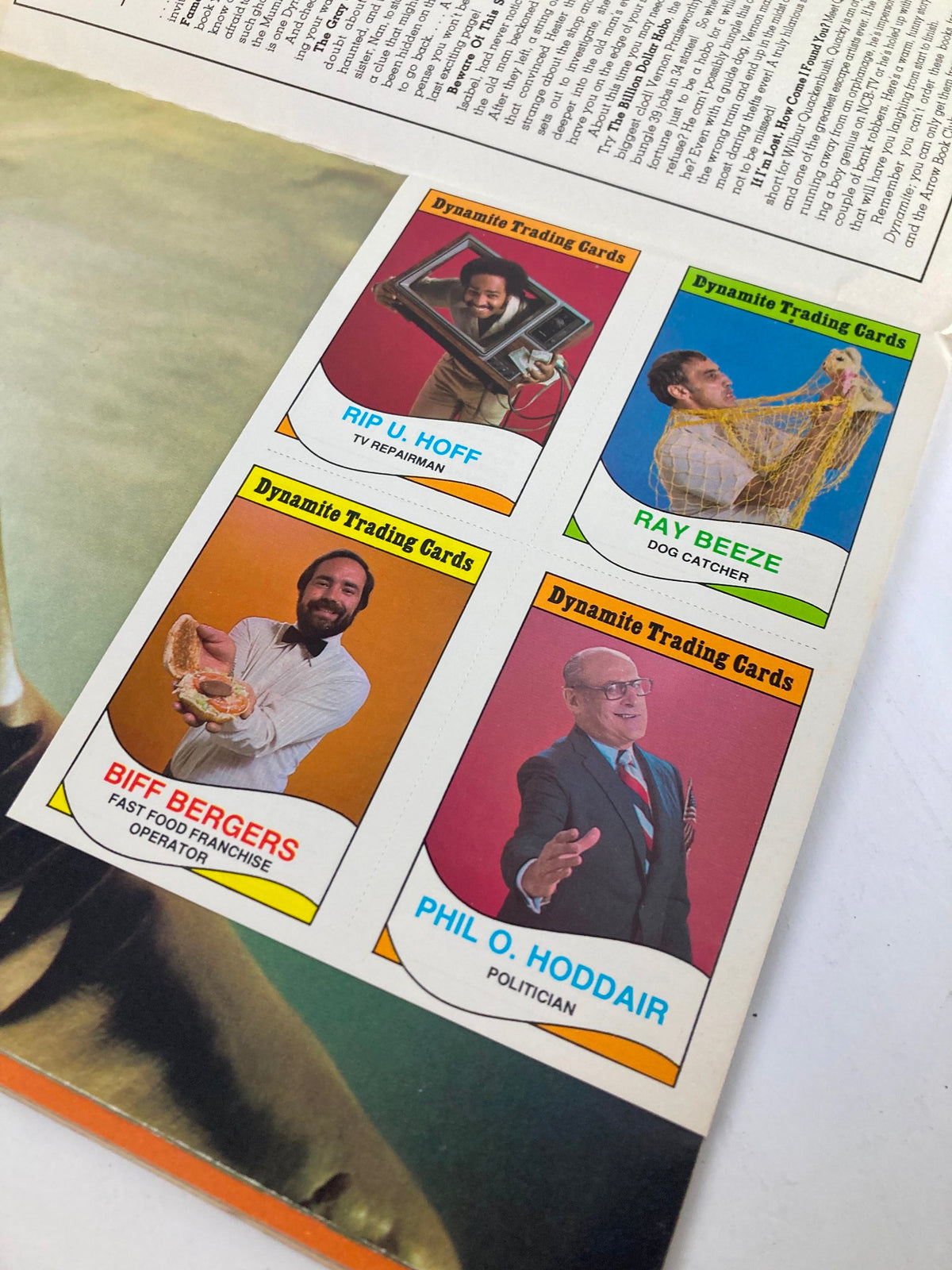 Close-up of trading cards from VTG Dynamite Magazine No. 53, displaying unique characters like Rip U. Hoff, Ray Beeze, and Phil O. Hoddair.