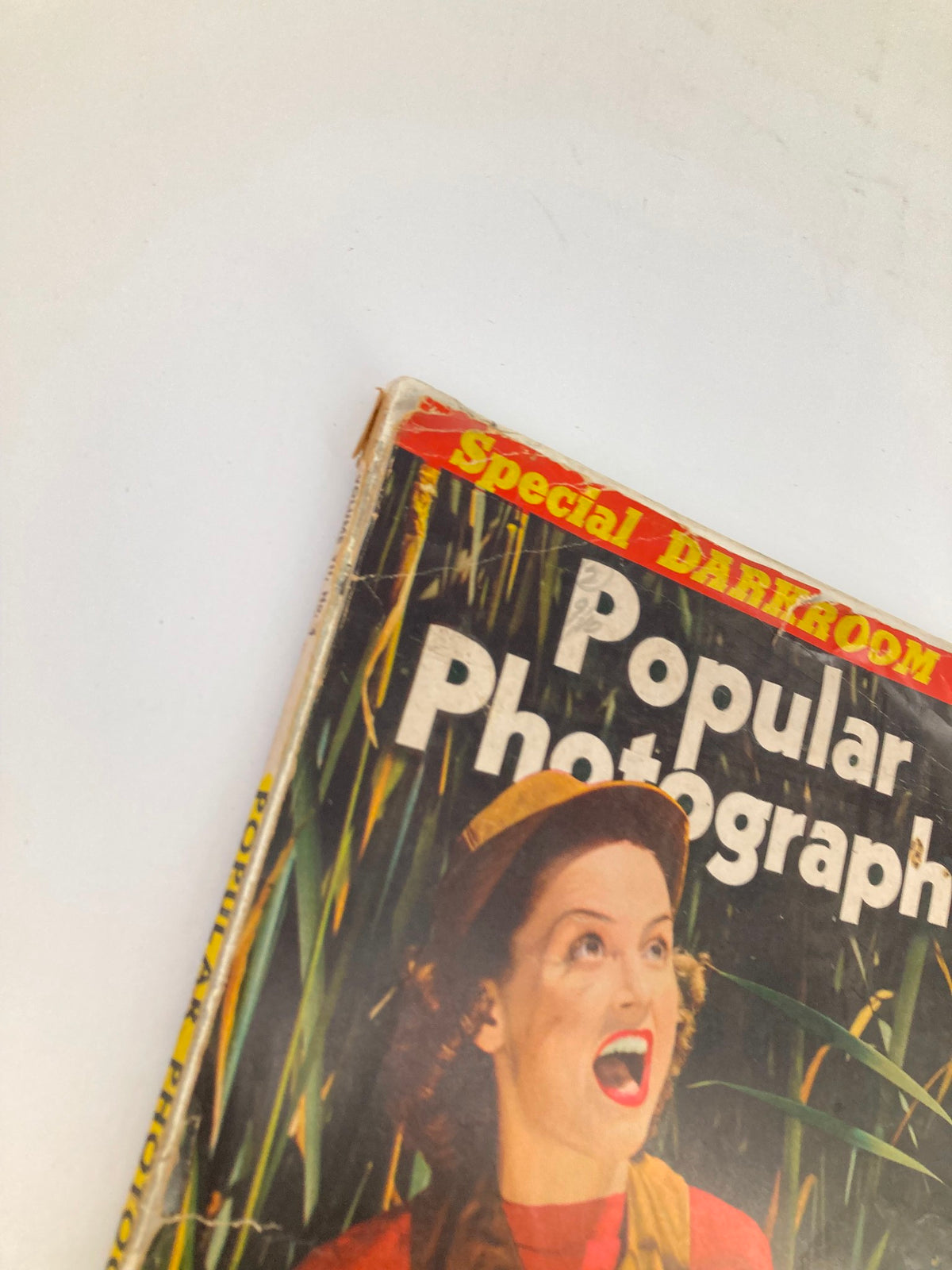 Close-up of the front cover of the VTG Popular Photography Magazine October 1940, highlighting the title and date, showcasing vintage photography charm.