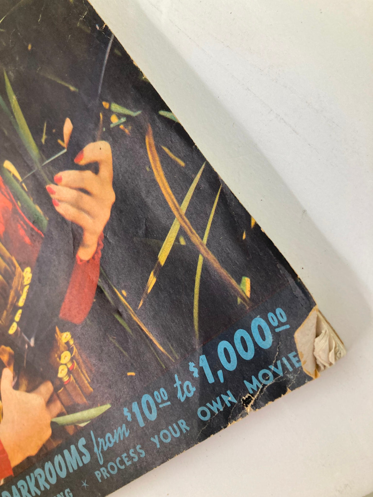 Detailed view of the lower section of the cover of the VTG Popular Photography Magazine October 1940, emphasizing the budget dark room information and vintage aesthetics.