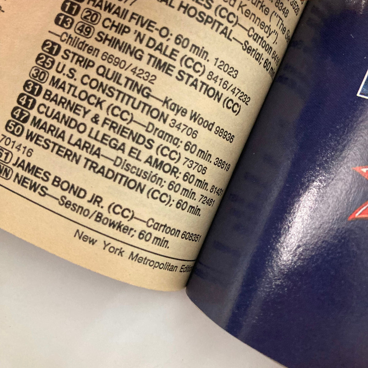 TV Guide Magazine October 10 1992 Paul Reiser and Helen Hunt NY Metro Ed. - A close-up view of the TV listings page showcasing shows like 'Hawaii Five-O,' 'Matlock,' and 'James Bond Jr.' with detailed information on airing times and episode lengths.