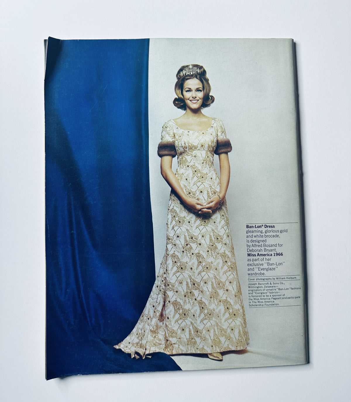 Image from the Miss America Pageant Magazine September 1966 showcasing a contestant in a beautiful gown with a description of her attire, emphasizing elegance during the pageant.