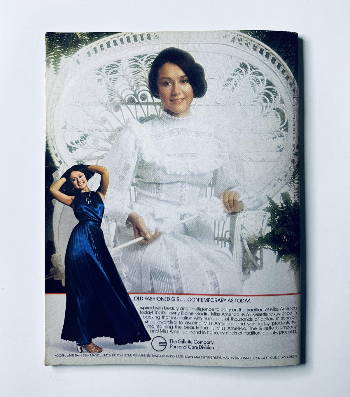 Back cover of the Miss America Pageant Magazine featuring an elegant model in an evening gown, promoting the theme of 'Old Fashioned Girl... Contemporary as Today'.