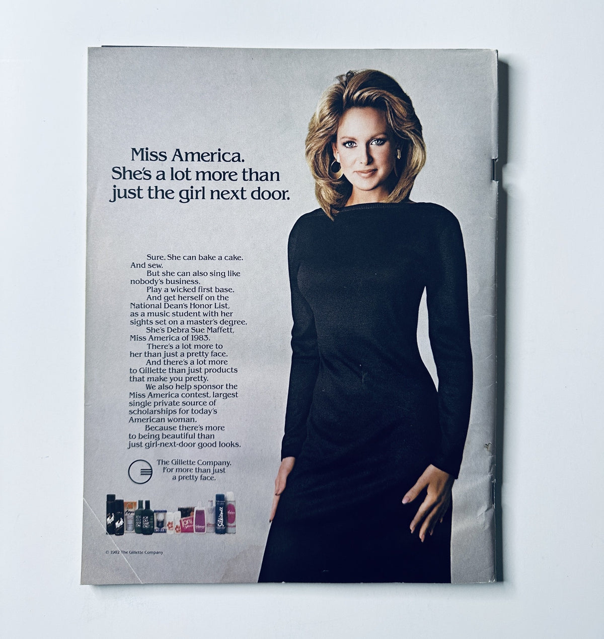 Back cover of The 1983 Miss America Pageant Magazine Official Program featuring a promotional advertisement for beauty products with a model showcasing Miss America themes.