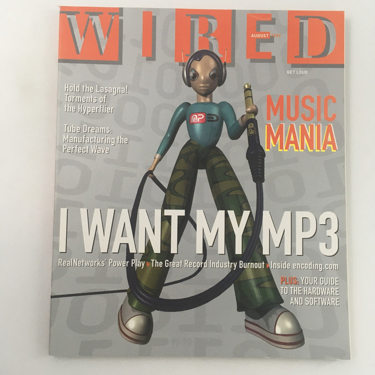 Cover of Wired Magazine from August 1999 titled 'Tube Dreams: Manufacturing Perfect Wave' featuring a stylized character with headphones and an audio cable, highlighting themes of technology and music.