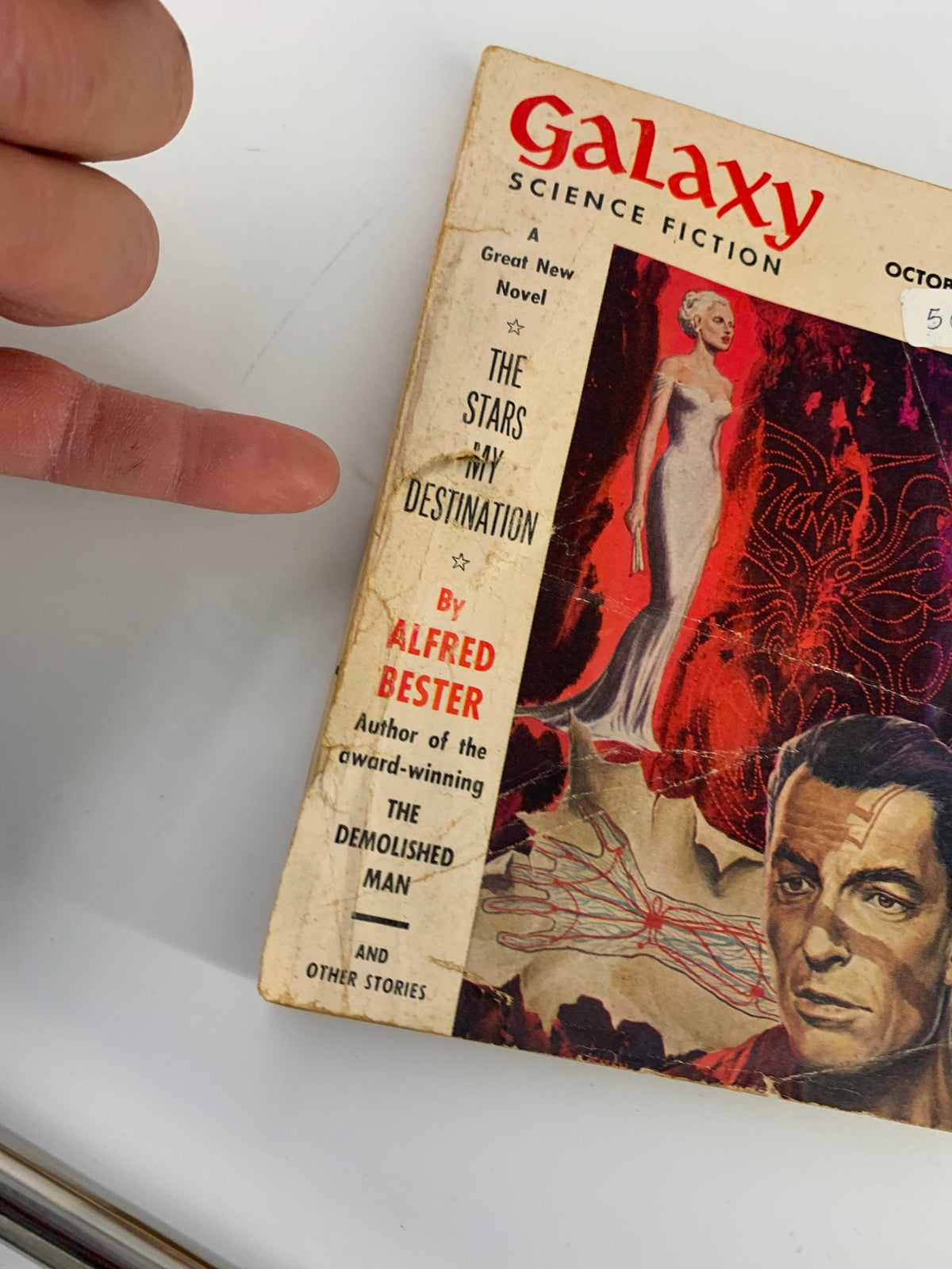 Cover of VTG Galaxy Science Fiction Magazine October 1956 featuring 'The Stars in My Destination' by Alfred Bester. The cover displays vintage artwork indicative of the science fiction genre.