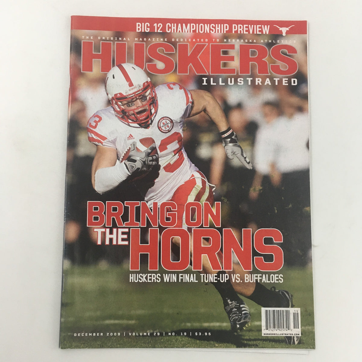 Huskers Illustrated December 2009 Vol 29 #19 magazine cover featuring football player in action with title 'Bring On The Horns' and highlights of Huskers win vs. Buffaloes.
