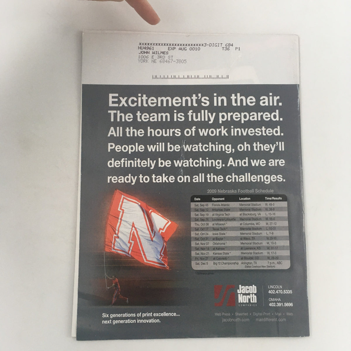 Back cover of Huskers Illustrated December 2009 Vol 29 #19 magazine showcasing a football schedule and promotional content with a Nebraska 'N' logo.