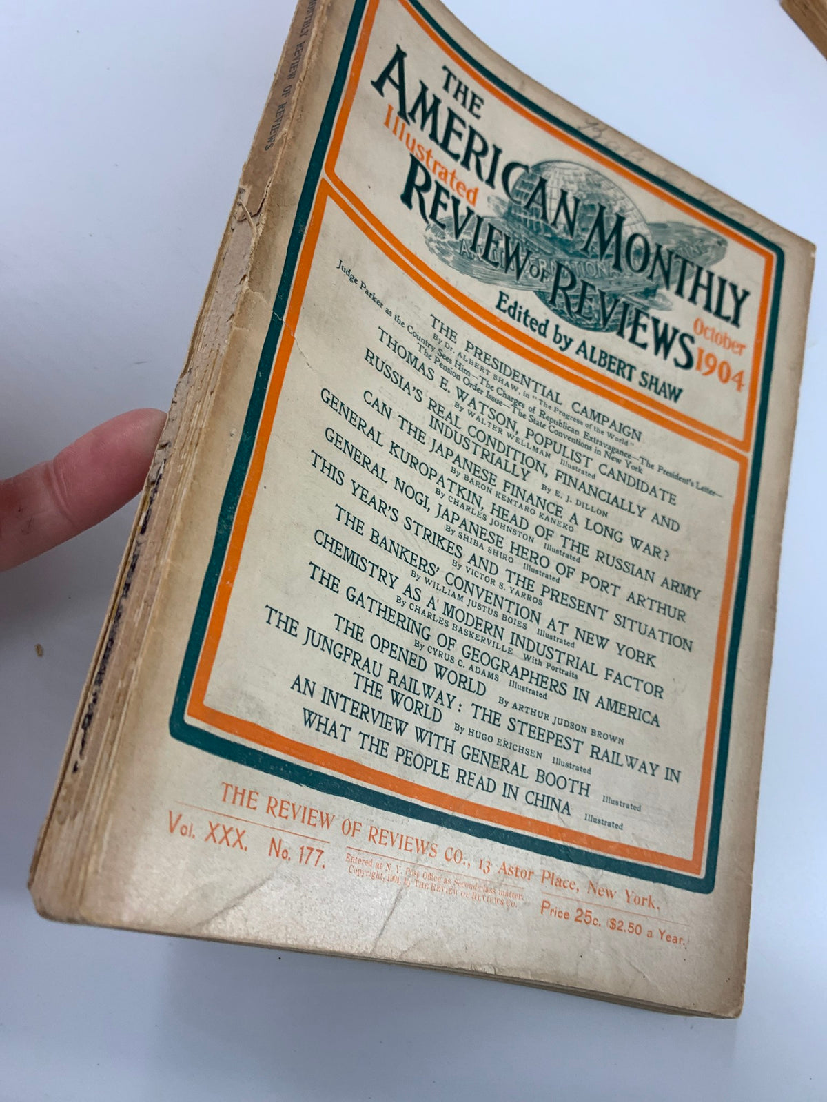 Side view of the worn cover of VTG The American Monthly Magazine October 1904, emphasizing its age and historical significance in American political history.