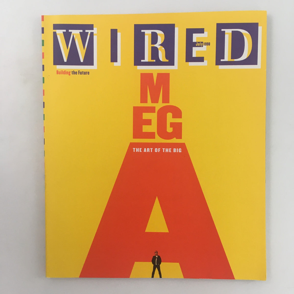 Wired Magazine July 1998 cover featuring bold yellow background and large red lettering reading 'MEGA' and 'THE ART OF THE BIG'. This iconic issue explores future architecture and urban planning, making it a must-have for collectors.