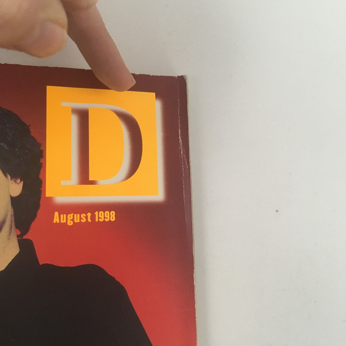 Close-up of the Wired Magazine August 1998 cover featuring the letter 'D' and the publication's date, emphasizing its vintage appeal and significance in technology history.