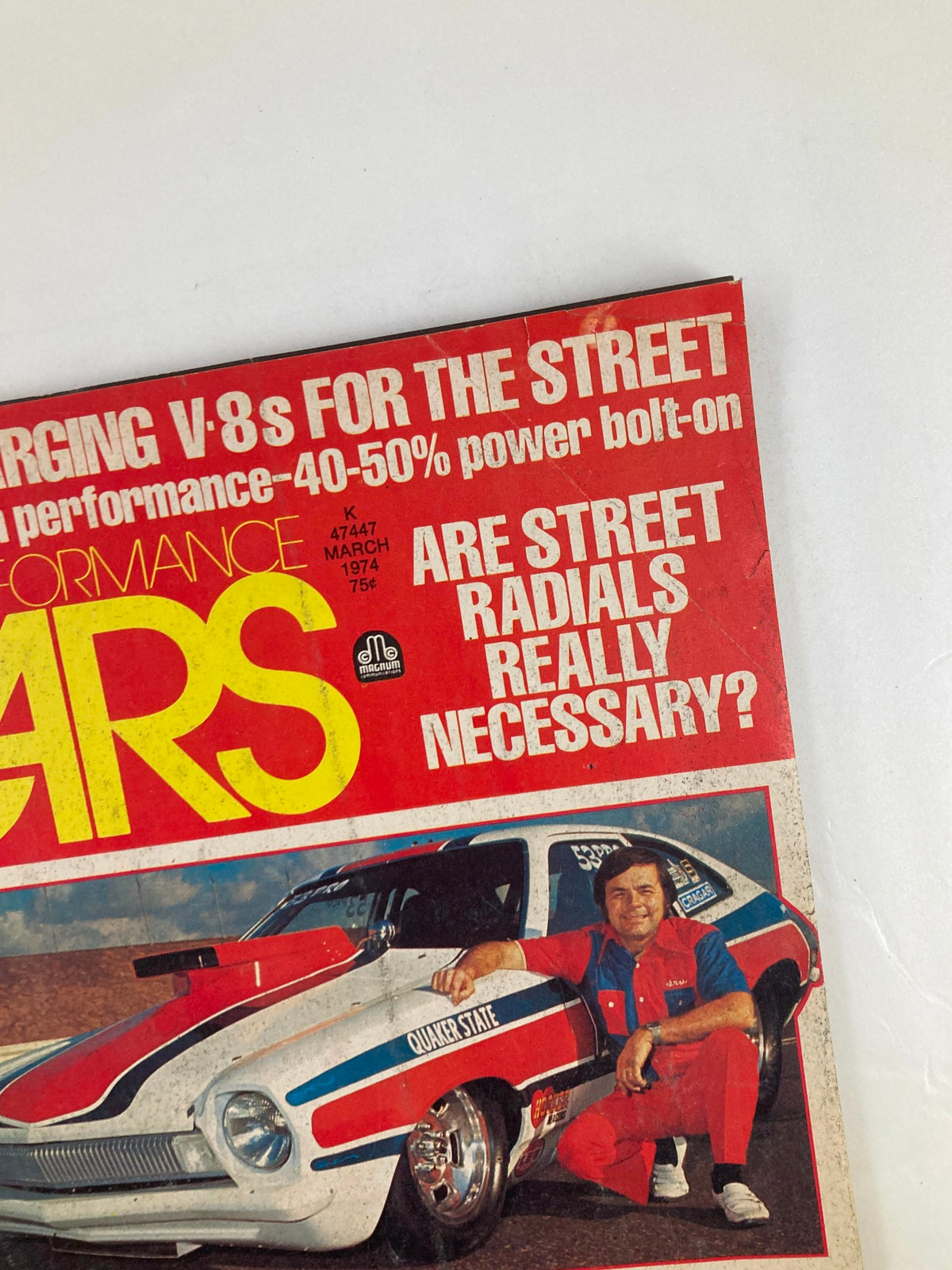 Close-up of the VTG Cars Magazine March 1974 Vol 17 #3 cover highlighting 'Turbocharging V-8s for the Street', featuring a striking image of a race car and an automotive enthusiast, with an eye-catching title design.