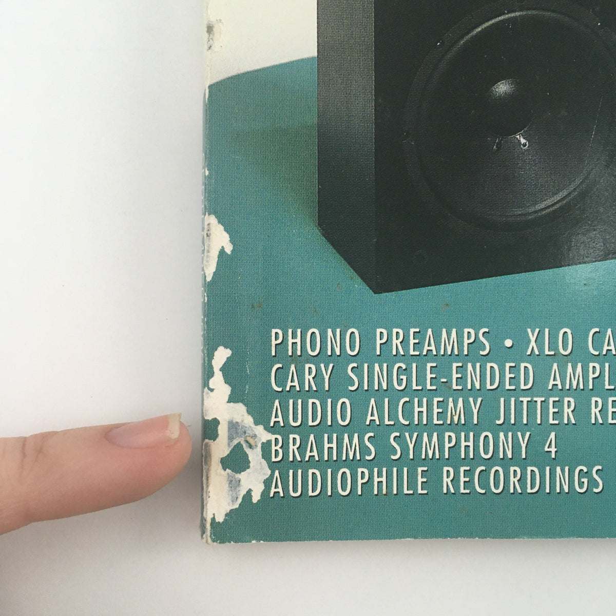 Close-up of Stereophile Magazine September 1995 detailing components like the Cary Single-Ended Amplifier, phono preamps, and audiophile recordings. The page shows the magazine's age with wear and tear, highlighting its collectible status.