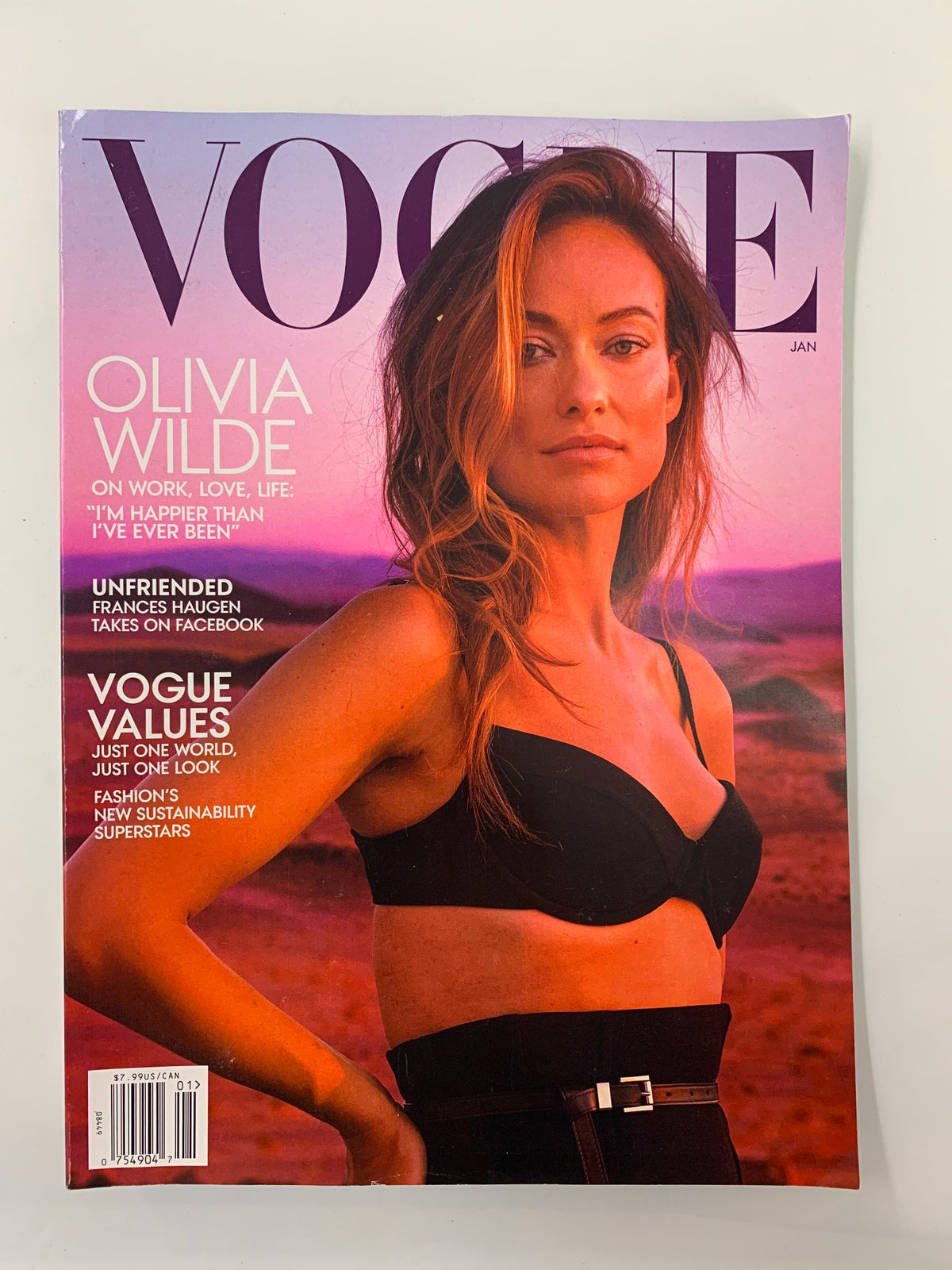 Vogue Magazine January 2022 cover featuring Olivia Wilde, showcasing her on a scenic background with the title and headlines focusing on work, love, and life.