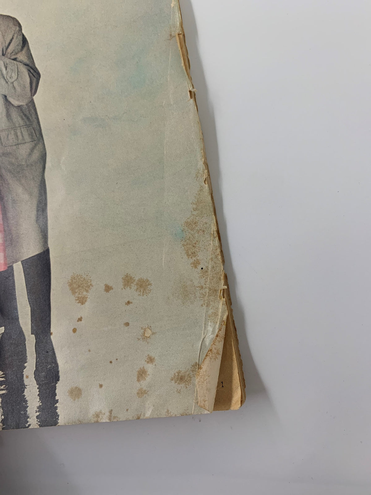 Side view of the battered edge of VTG Teen-Agers Ingenue Magazine March 1962, highlighting the vintage condition with visible wear and stains.