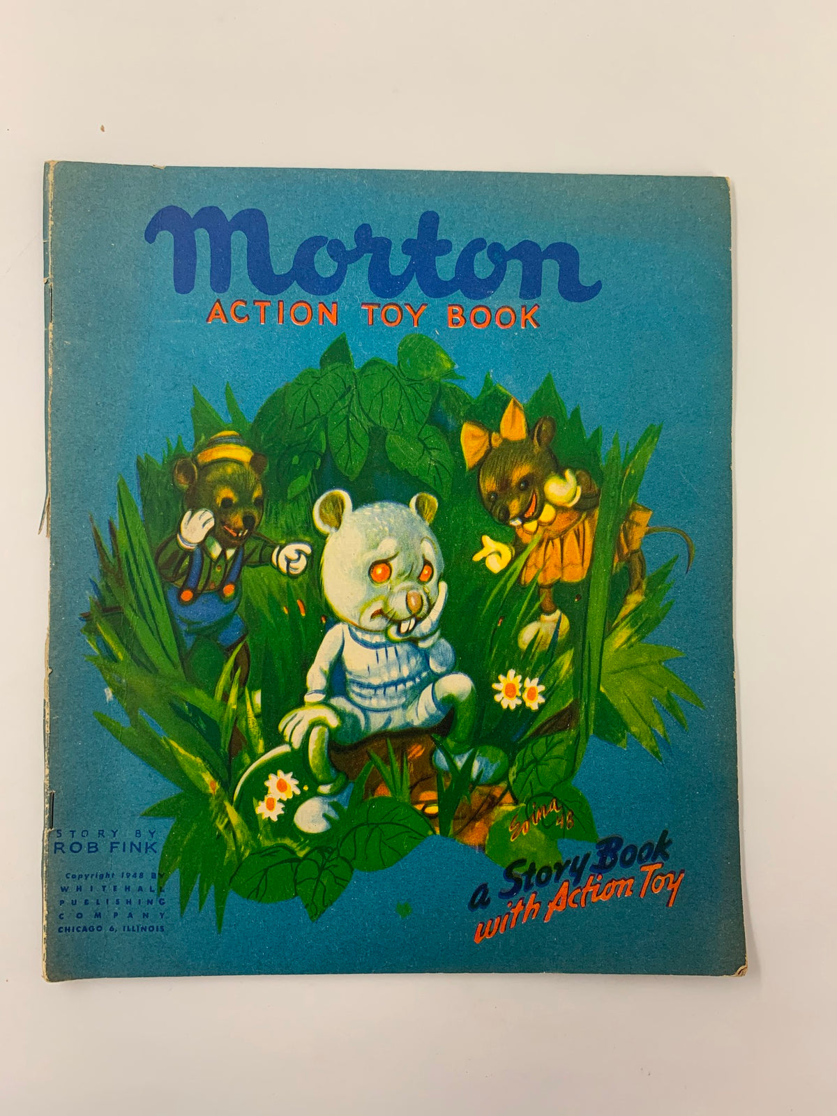 Cover of the 1948 Morton Action Toy Book featuring a whimsical illustration of a bear and playful characters in a lush garden setting, promoting a unique storytelling experience with an action toy.