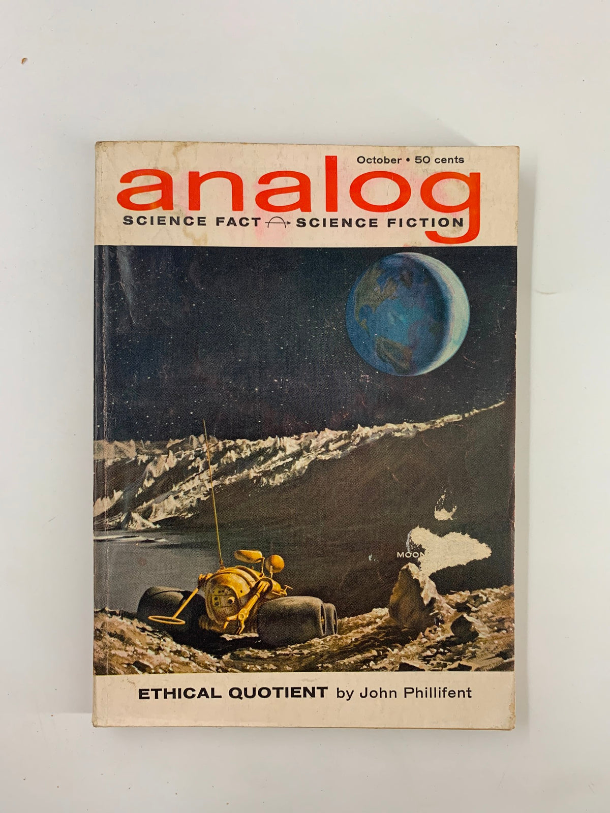 Cover of VTG Analog Magazine October 1962 featuring 'Ethical Quotient' by John Phillifent, showcasing a space-themed illustration with a lunar landscape and a spacecraft.