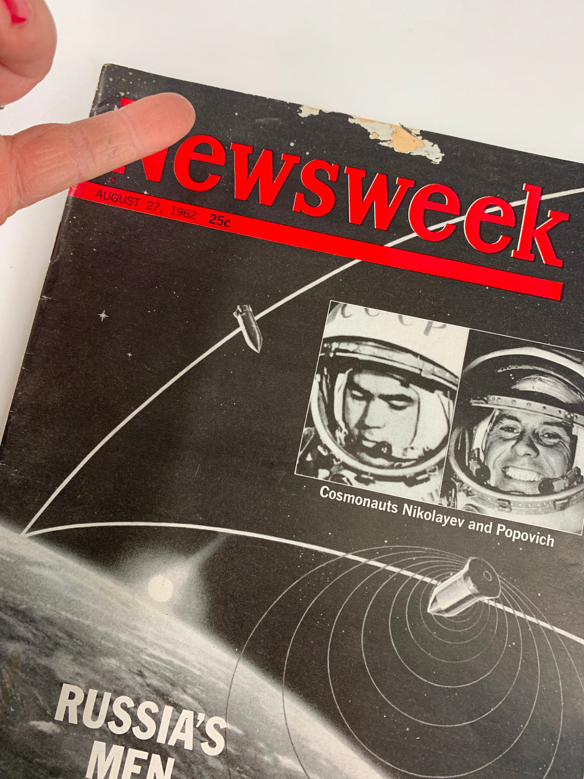 VTG Newsweek Magazine August 27 1962 cover featuring cosmonauts Andriyan Nikolayev and Pavel Popovich, highlighting Russia's achievements in space exploration with a striking design and notable wear.