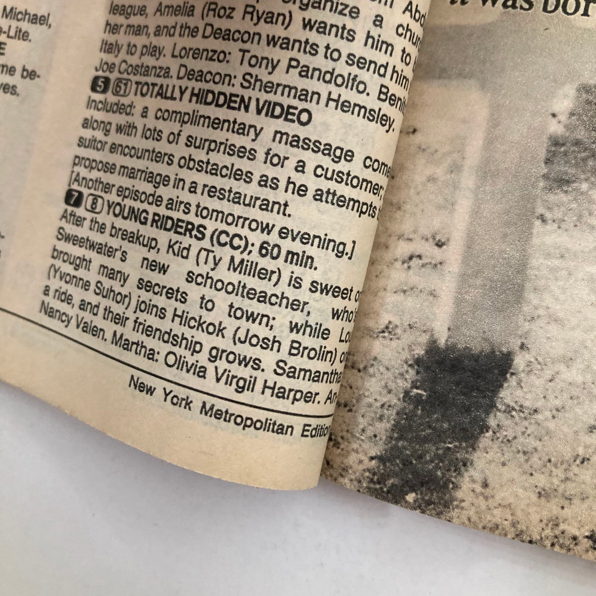 Close-up view of the programming highlights from the TV Guide Magazine February 9 1991 featuring Desi Arnaz and Lucille Ball. This edition includes descriptions of shows like 'Totally Hidden Video' and 'Young Riders', showcasing early '90s television content.