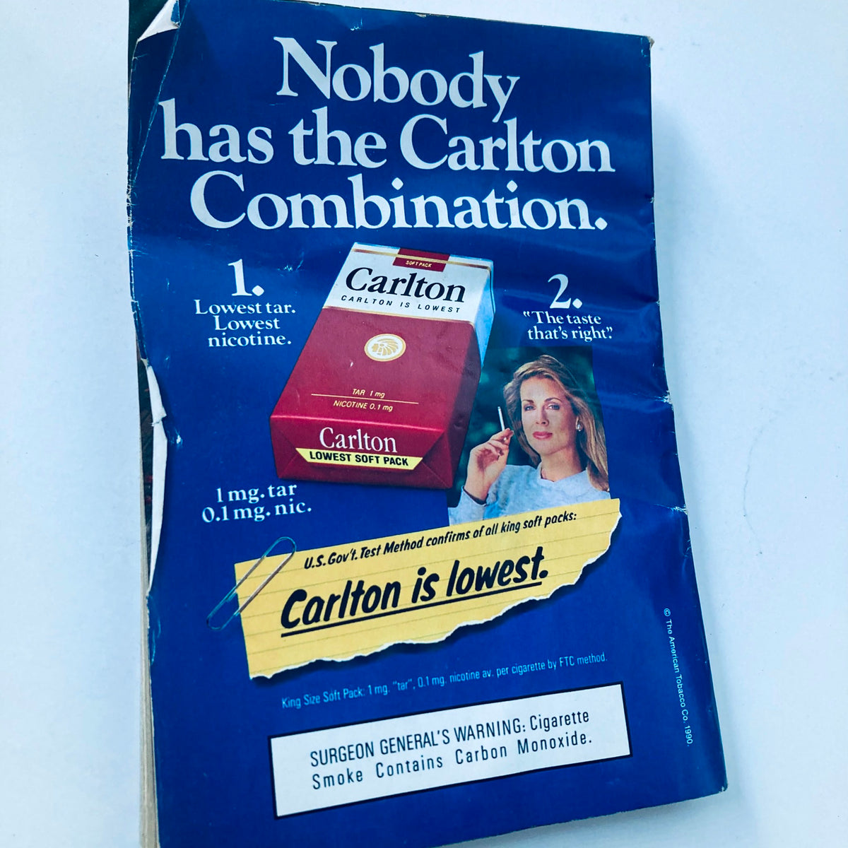Back advertisement page in TV Guide Magazine April 28, 1990 for Carlton cigarettes, showcasing their features and promoting the brand's message.