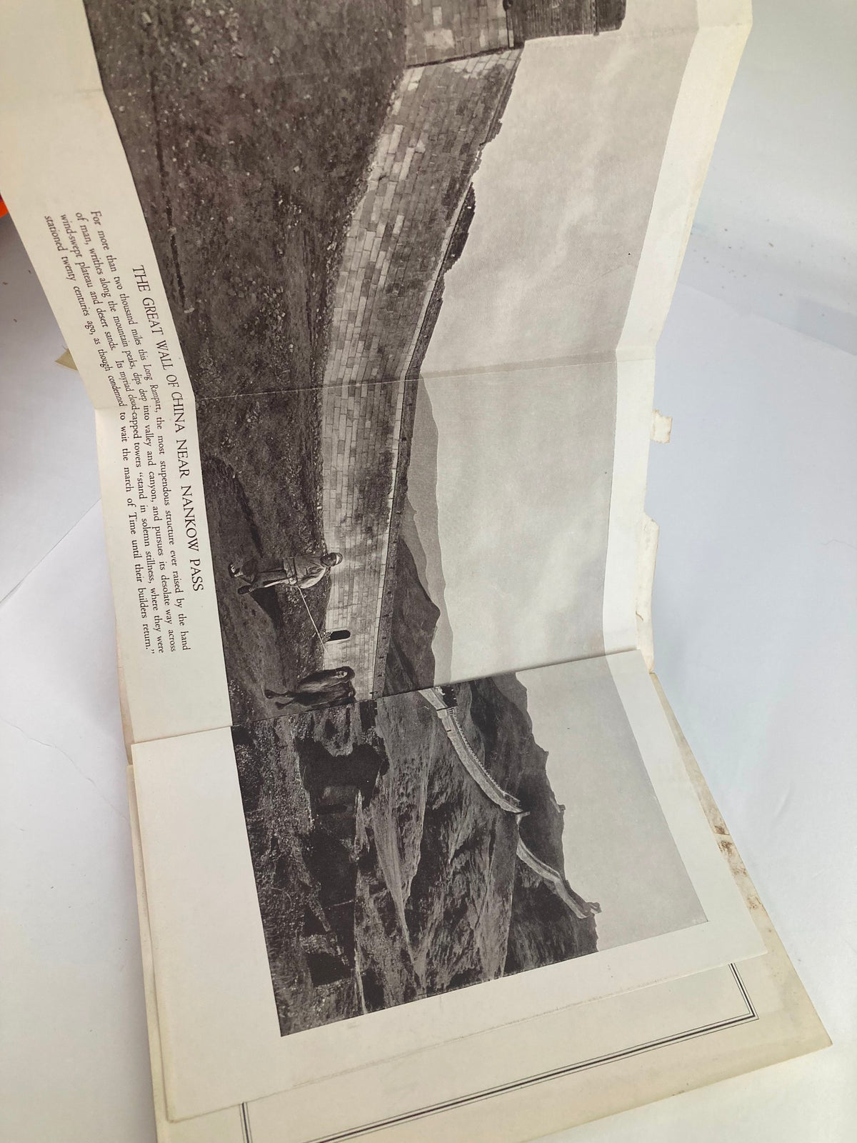 Open page of The National Geographic Magazine, February 1923 edition, displaying a photograph and article about the Great Wall of China, showcasing its grandeur.