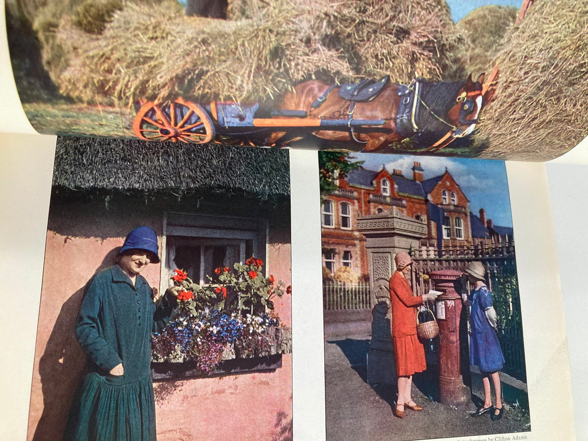 Vintage National Geographic Magazine March 1927 images displaying scenes of rural life, featuring women in traditional clothing with flowers and a picturesque village setting.