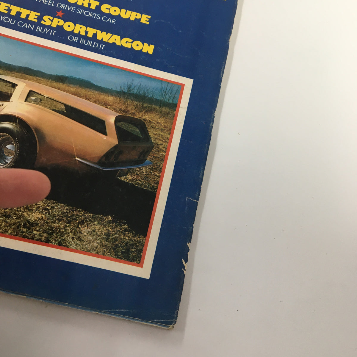 Close-up view of the cover of VTG Car and Driver Magazine July 1972, highlighting 'Corvette Sportwagon' and showcasing a detailed image of a sports car.