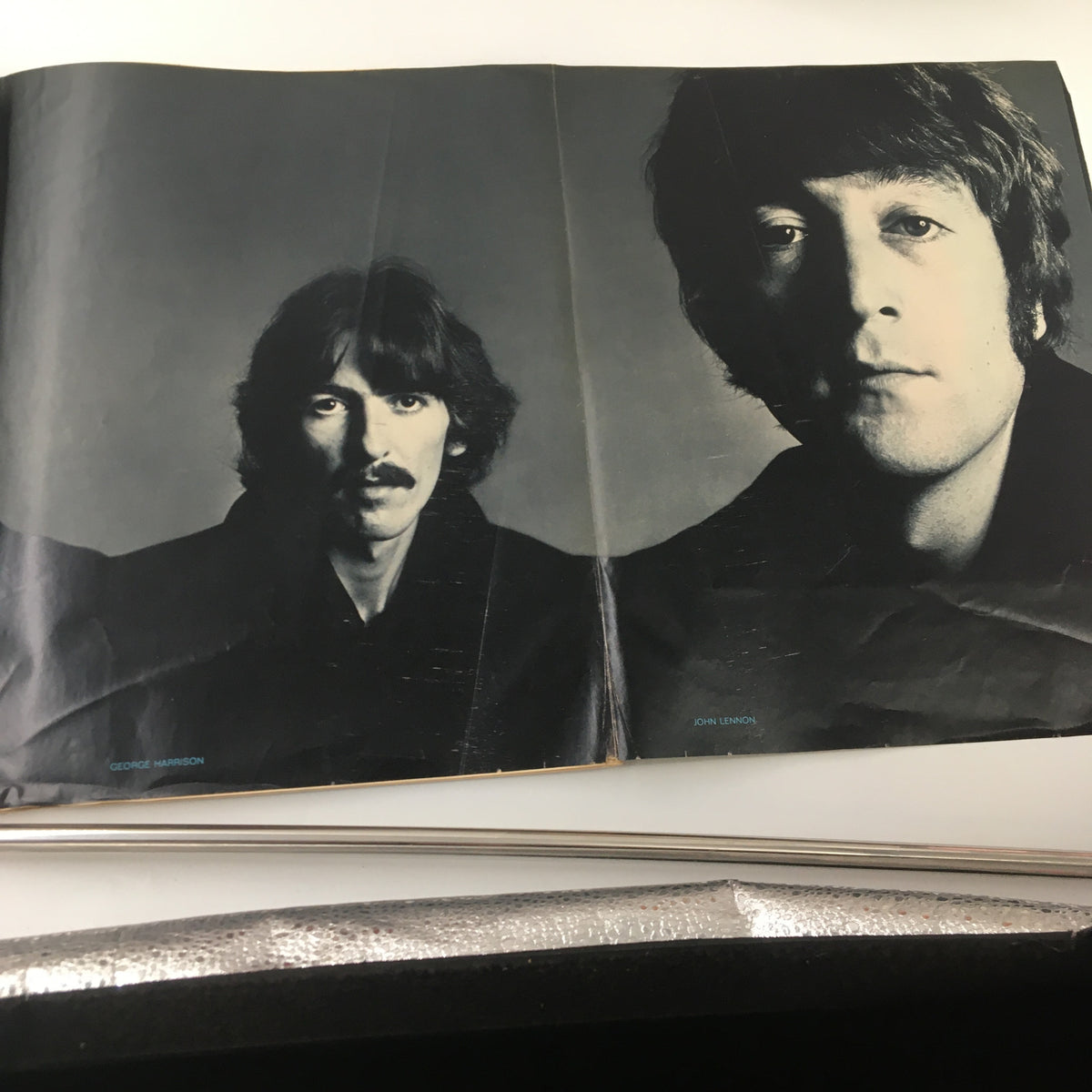 Black and white portrait spread of George Harrison and John Lennon from the VTG Look Magazine January 9 1968, highlighting The Beatles.