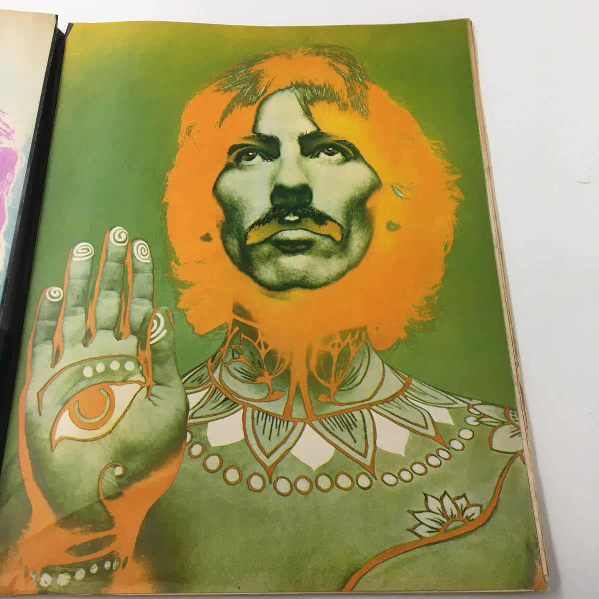 Striking illustration of George Harrison adorned with decorations, from the VTG Look Magazine January 9 1968, reflecting the era's artistic style.