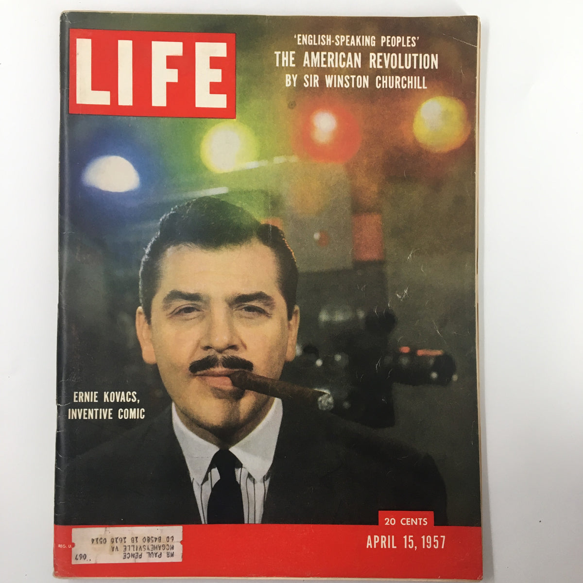 Cover of VTG Life Magazine April 15 1957 featuring Ernie Kovacs, an inventive comic, depicted with a cigar against a colorful background, representing the humorous artistry of the late 1950s.