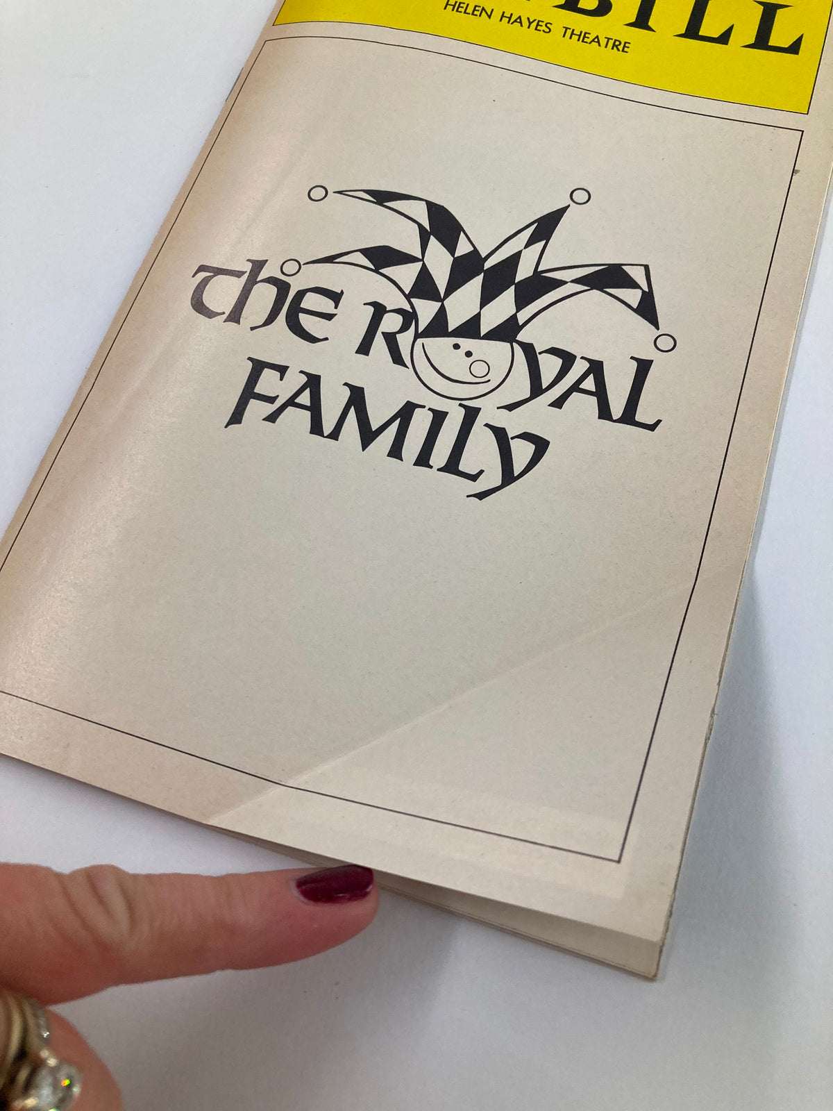 Close-up view of the 1976 Playbill for The Royal Family at Helen Hayes Theatre highlighting the front cover details.