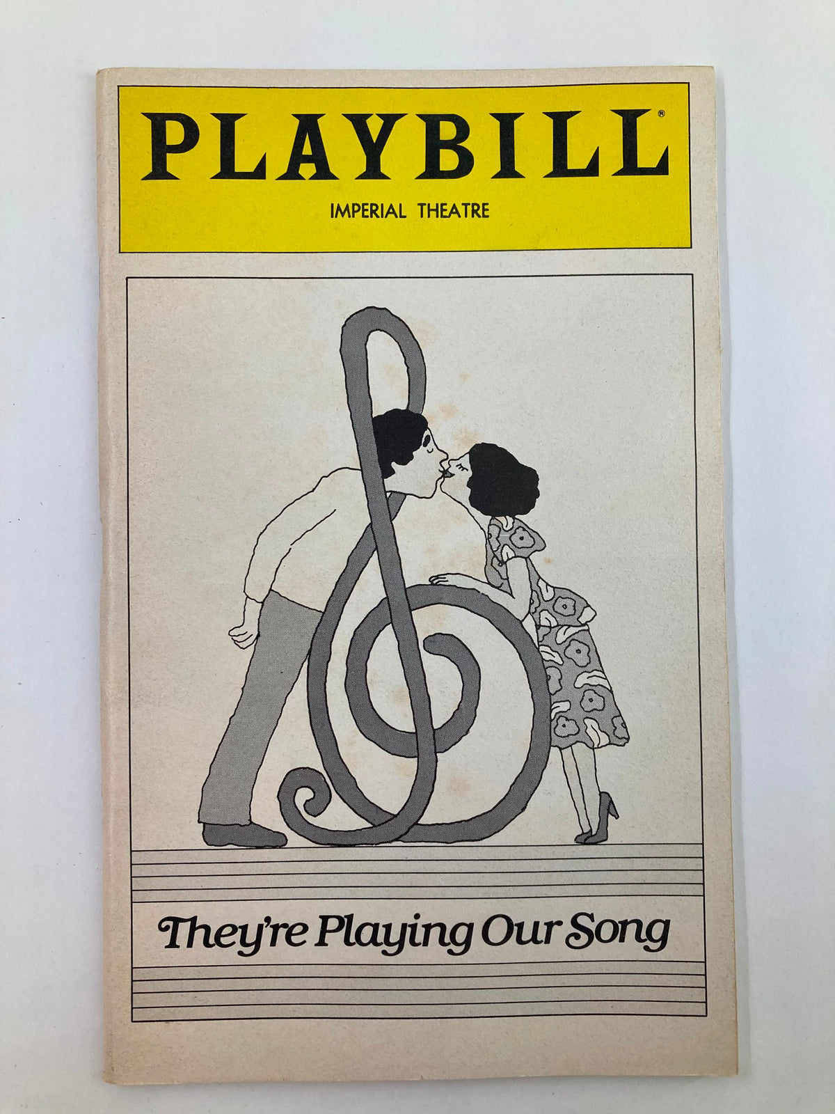 1980 Playbill for 'They're Playing Our Song' at the Imperial Theatre, featuring a whimsical illustration of a couple with a treble clef.