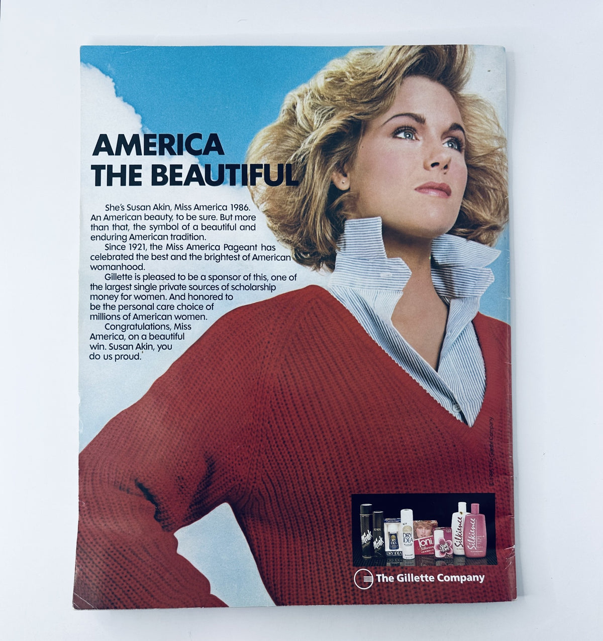 The 1986 Miss America Pageant Magazine Official Program back cover featuring Susan Akin, emphasizing her role as Miss America and the theme 'America the Beautiful'.