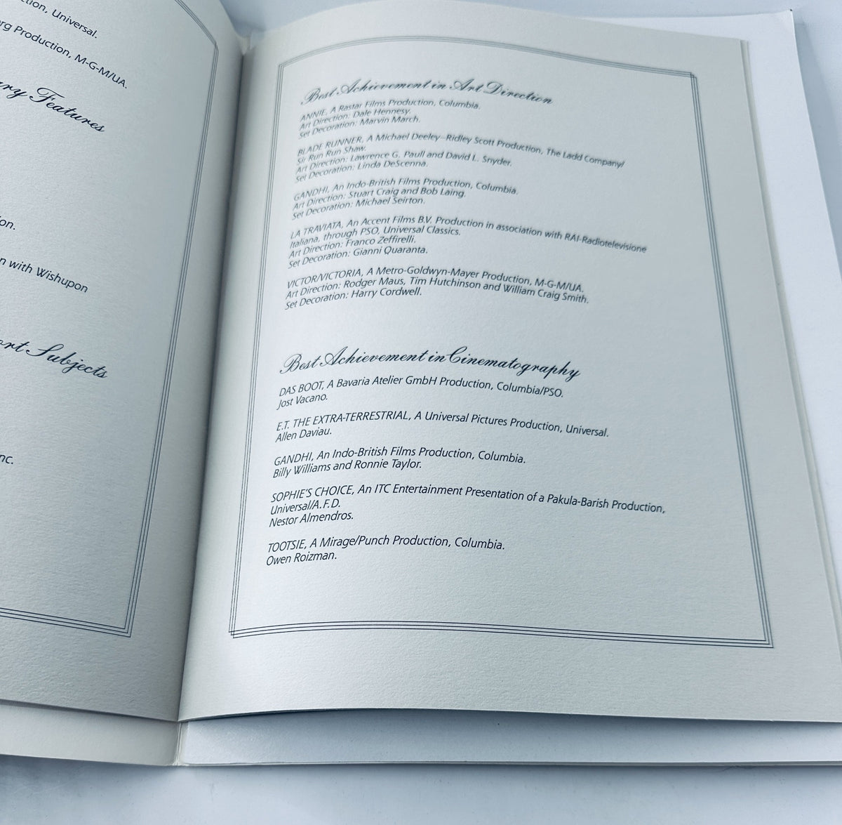 Inside page of the Oscar Magazine 55th Annual Academy Awards Program from April 11, 1983, displaying award categories such as Best Achievement in Art Direction and Best Achievement in Cinematography.