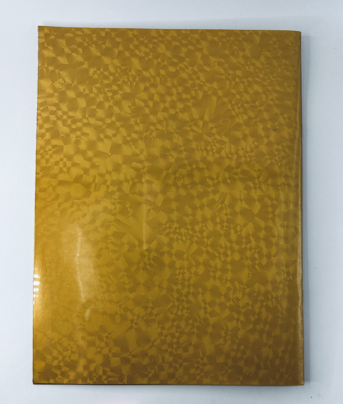 Cover of the Oscar Magazine 57th Annual Academy Awards Program March 25, 1985, displaying a glossy golden patterned design.
