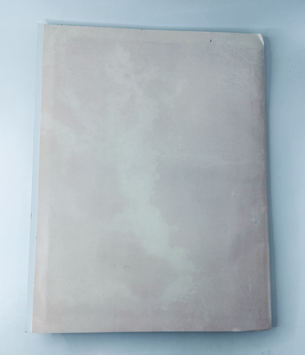 Back cover of the Oscar Magazine 58th Annual Academy Awards 1986 Program, showcasing a minimalistic design in light colors.