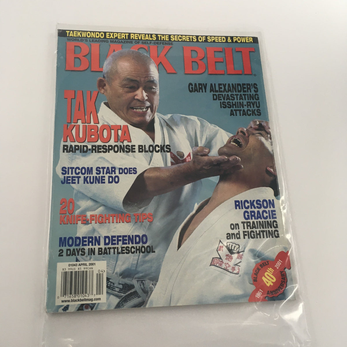 Cover of the Black Belt Magazine April 2001 featuring Gary Alexander's Isshin-Ryu Attacks, with a focus on Tak Kubota's rapid-response blocks and Rickson Gracie on training and fighting.