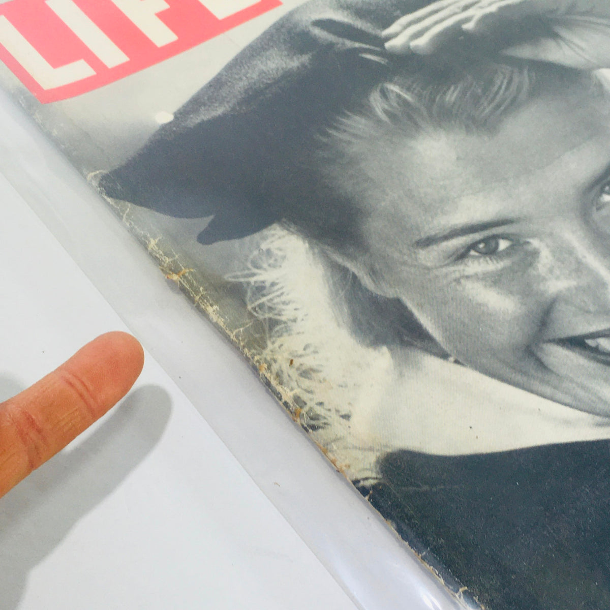 Close-up of the cover of VTG Life Magazine from June 22, 1953, showcasing details of the graduate's attire and imperfections that highlight the magazine's vintage character.