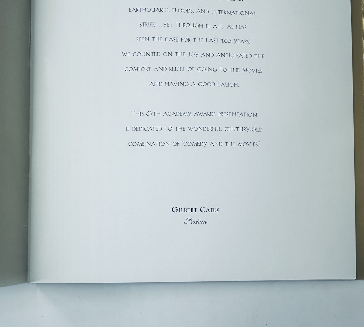Inside page of the 67th Annual Academy Awards Magazine Program, featuring a message from producer Gilbert Cates about the event and the comfort of movies during difficult times.