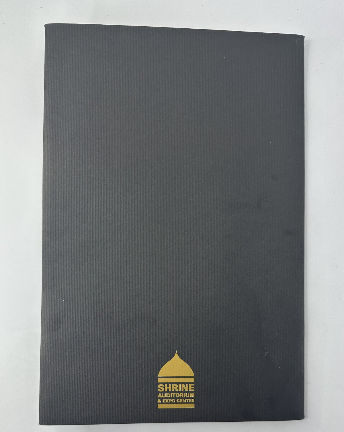 Cover of the 67th Annual Academy Awards Magazine Program 1995 Oscar Ceremony, featuring a black design with the iconic Shrine Auditorium logo.