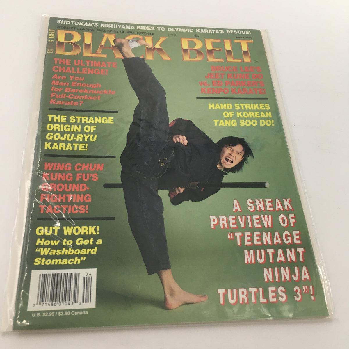 Cover of Black Belt Magazine April 1993 featuring articles on Bruce Lee's Jeet Kune Do and Ed Parker's Kenpo, showcasing an action pose with martial artist kicking and wielding a weapon.
