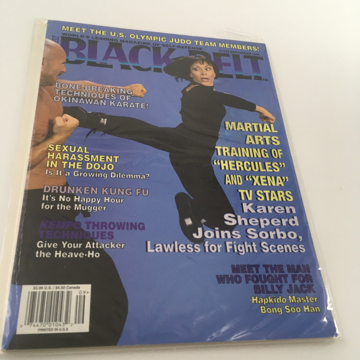 Cover of Black Belt Magazine from September 1996 featuring Karen Sheperd in action, demonstrating martial arts techniques, highlighted with text on topics like self-defense and martial arts training.