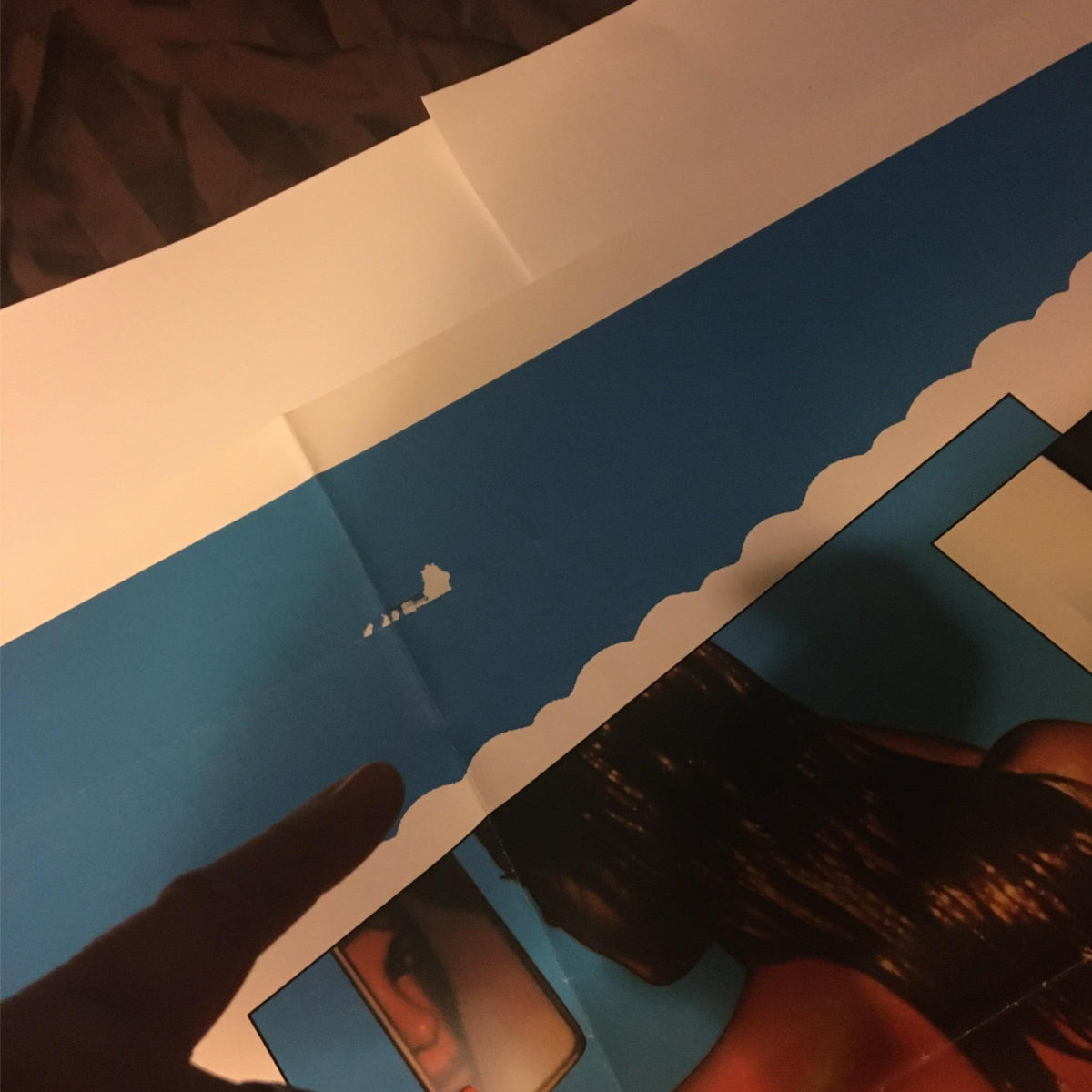 Close-up view of the 1984 Blame it on Rio movie poster, showcasing damage to the upper edge, maintaining its significance in film memorabilia.