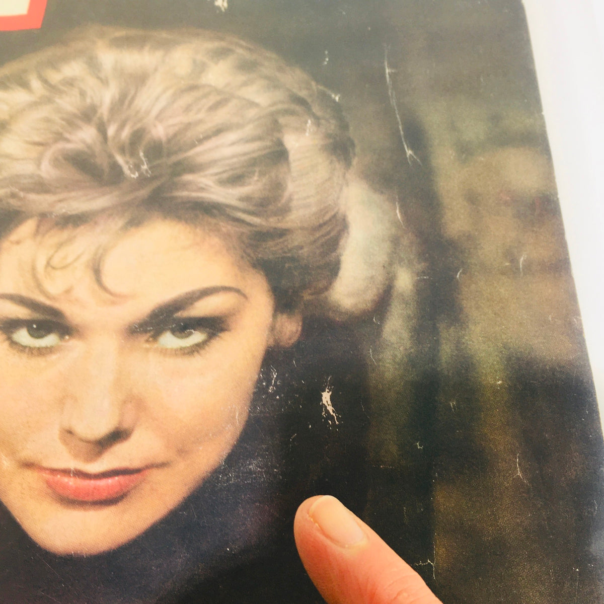 Detailed close-up of Kim Novak on the November 24, 1958 Vintage Life Magazine cover with a cat, emphasizing the vintage condition.